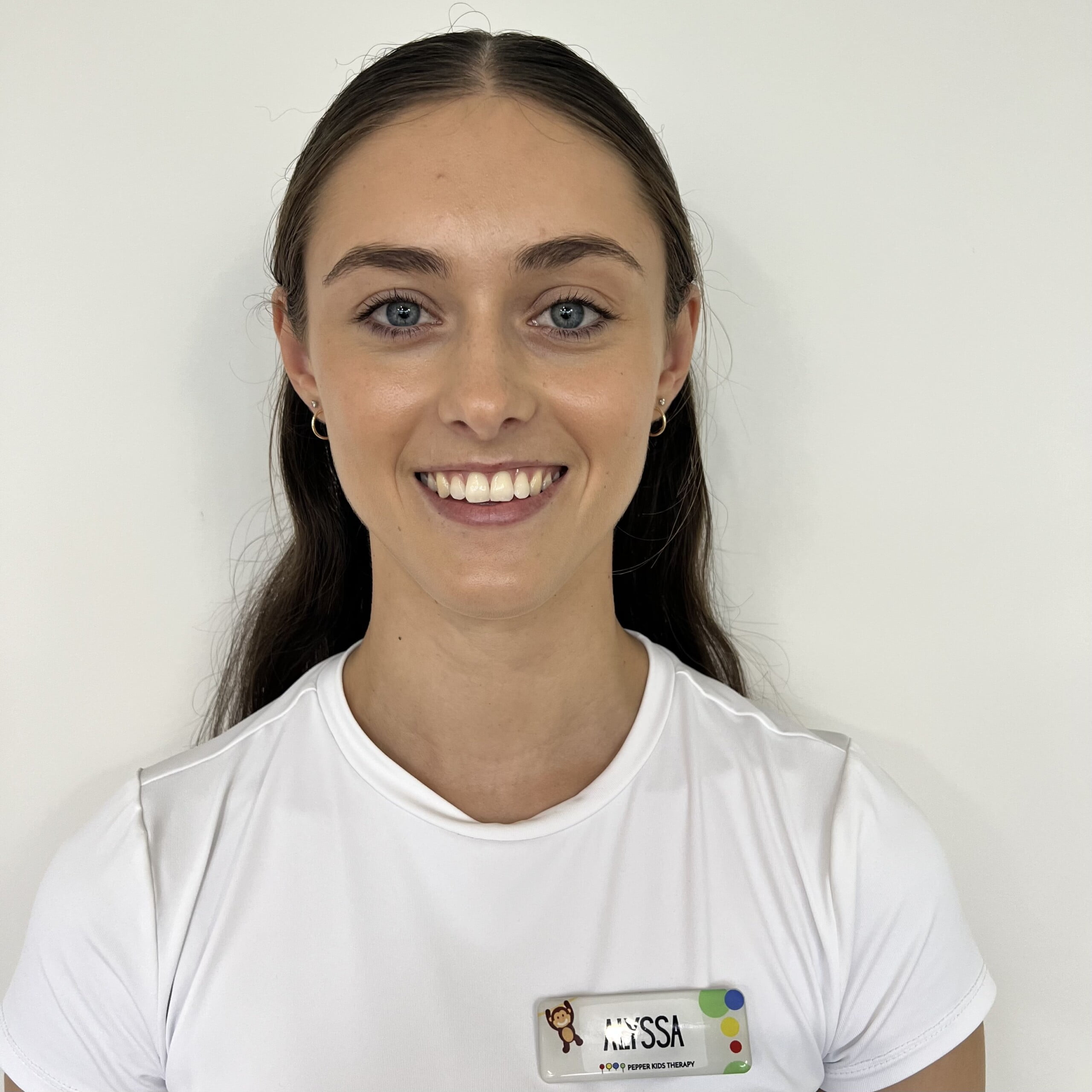 Alyssa Smith, a young woman, wearing a white t-shirt.